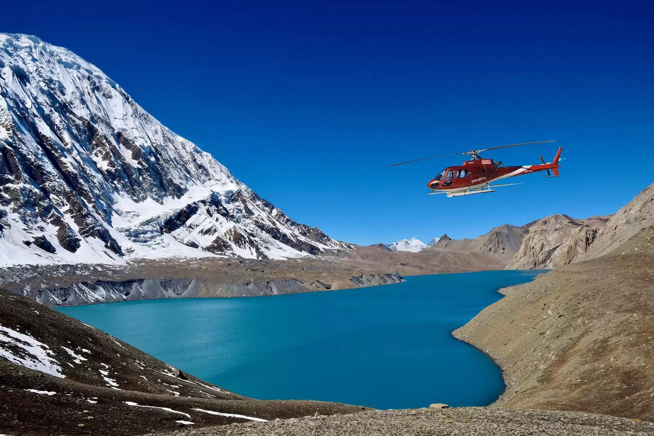 Tilicho Lake Helicopter Tour - A helicopter flying by tilicho lake